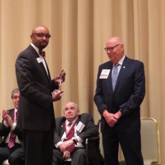 Vincent Cornelius presents James Holderman his award
