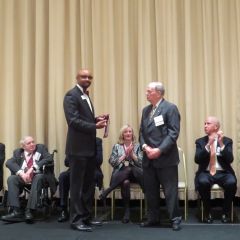 Vincent Cornelius presents Nicholas Motherway his award
