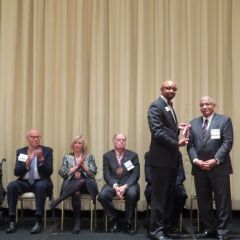Vincent Cornelius presents Larry Rogers his award

