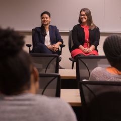 Maliha Siddiqui and Jenna DiJohn speak to an audience of law students at DePaul University College of Law.
